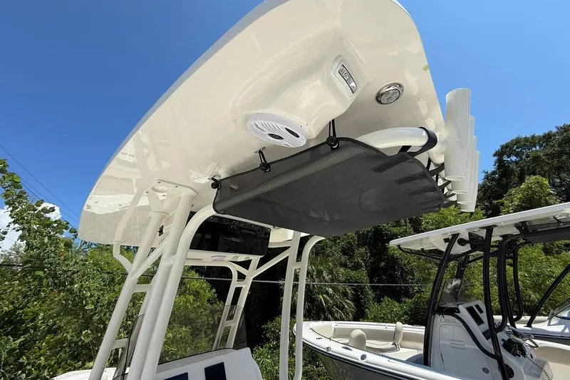 Slide: The Image of 2026 Key West 239 FS boat with T-top and rod holders under clear blue sky. - 11