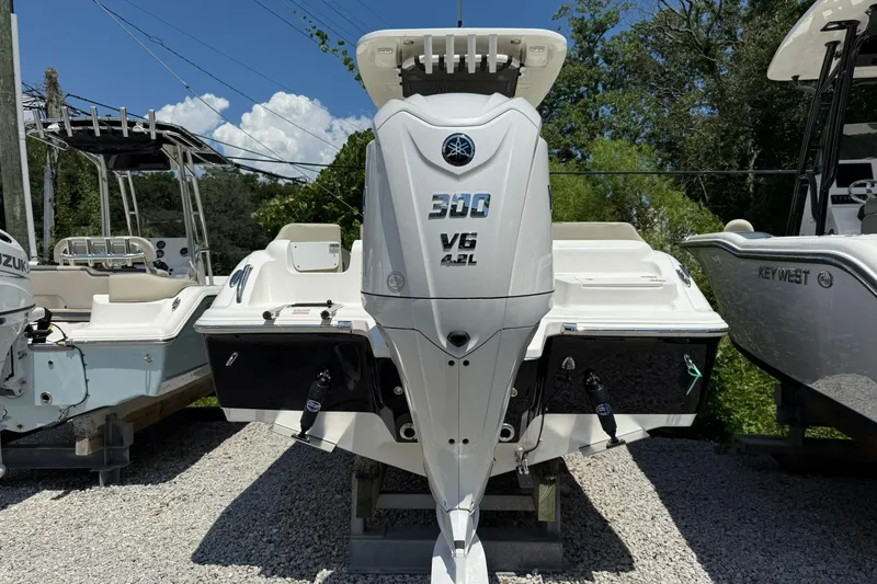 Slide: The Image of 2026 Key West 239 FS boat with Yamaha 300 V6 engine, displayed outdoors. - 2