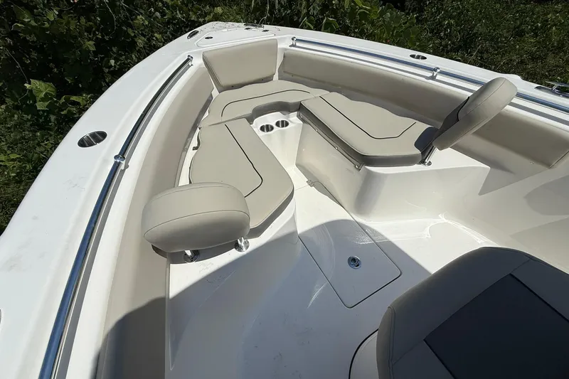 Slide: The Image of 2026 Key West 239 FS boat interior with cushioned seating and stainless steel railings. - 3
