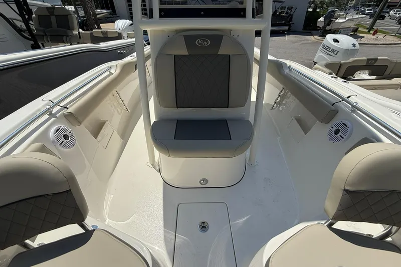 Slide: The Image of 2026 Key West 239 FS boat interior with seating and speakers. - 4