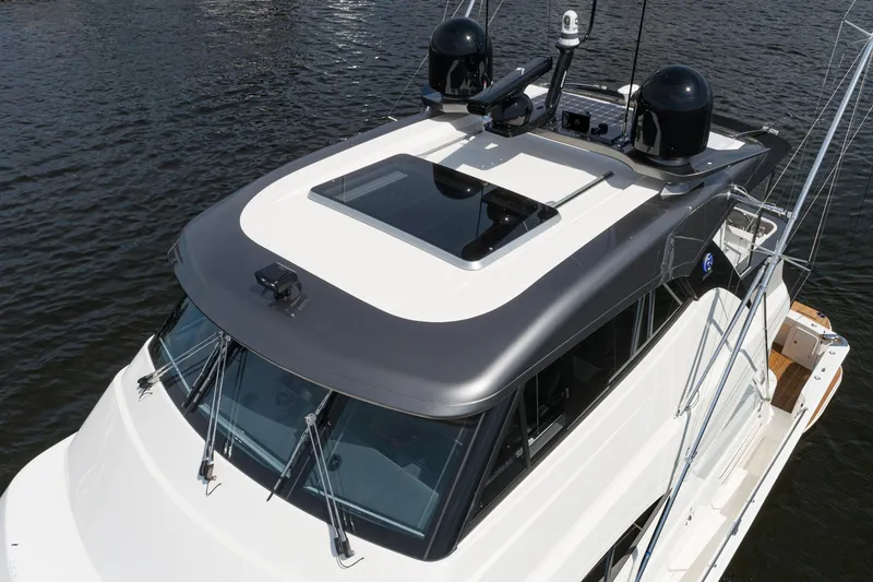 Slide: The Image of Control panel inside a compartment on a 2023 Riviera 64 Sports Motor Yacht. - 13