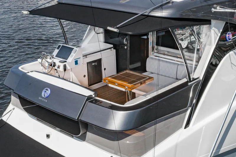 Slide: The Image of Open storage compartment on 2023 Riviera 64 Sports Motor Yacht deck. - 14