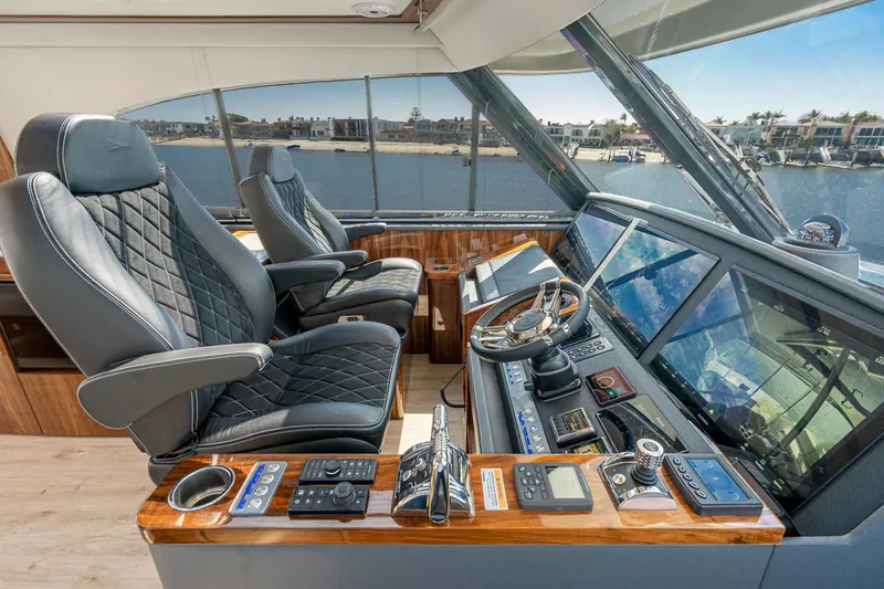 Slide: The Image of Luxurious interior of 2023 Riviera 64 Sports Motor Yacht with marina view. - 18
