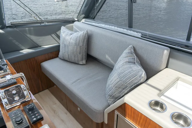 Slide: The Image of Luxurious interior of 2023 Riviera 64 Sports Motor Yacht with modern kitchen and seating area. - 20