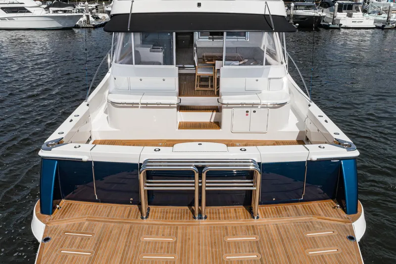 Slide: The Image of Luxurious interior of 2023 Riviera 64 Sports Motor Yacht with modern kitchen and panoramic windows. - 21