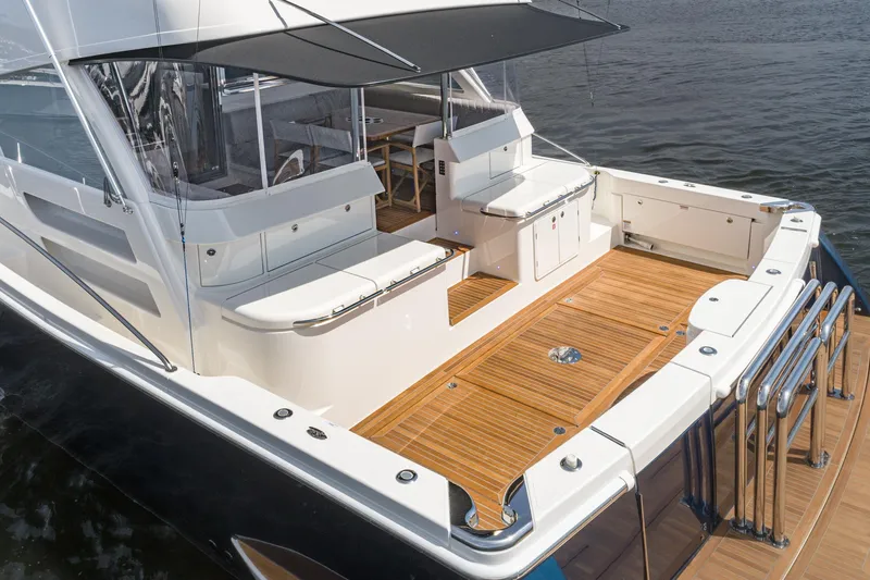 Slide: The Image of Luxurious interior of 2023 Riviera 64 Sports Motor Yacht with sleek wood finishes and modern design. - 23