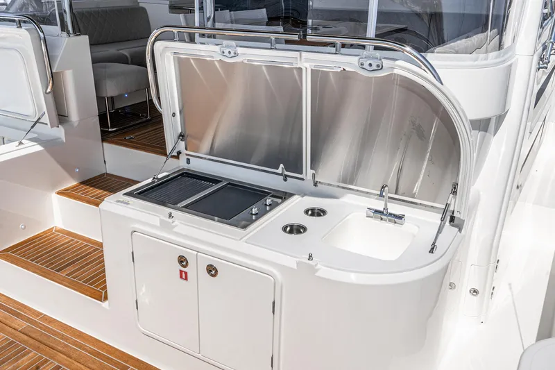 Slide: The Image of Luxurious interior of 2023 Riviera 64 Sports Motor Yacht with modern kitchen design. - 24