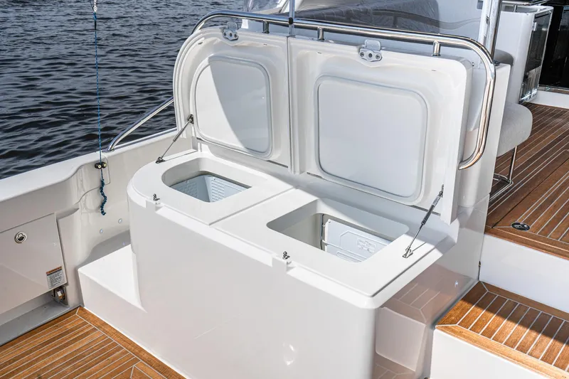 Slide: The Image of Luxurious interior of 2023 Riviera 64 Sports Motor Yacht with modern kitchen and ocean view. - 25