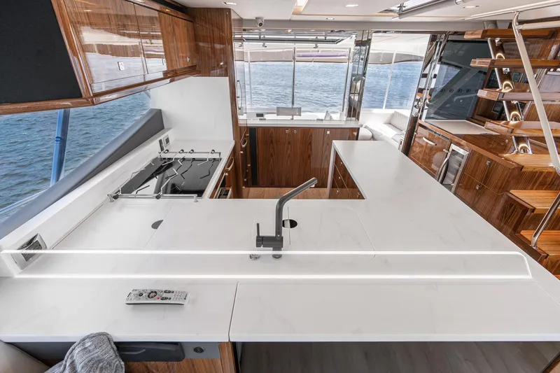 Slide: The Image of 2023 Riviera 64 Sports Motor Yacht helm with advanced navigation systems and luxurious interior. - 32