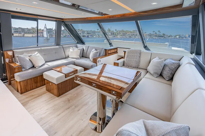 Slide: The Image of Luxurious interior of 2023 Riviera 64 Sports Motor Yacht with city skyline view. - 34