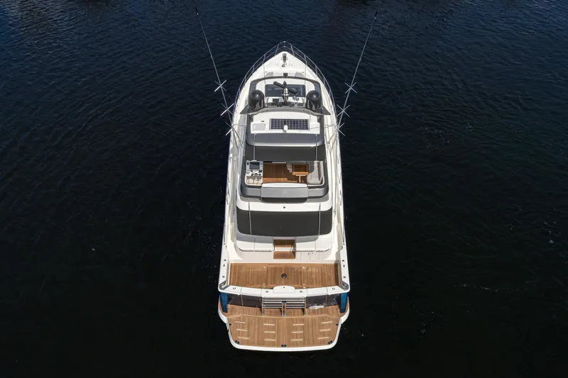 Slide: The Image of 2023 Riviera 64 Sports Motor Yacht on open water, rear view. - 4