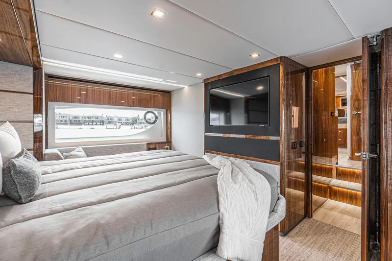 Slide: The Image of Luxurious interior of 2023 Riviera 64 Sports Motor Yacht with wood paneling and modern amenities. - 41