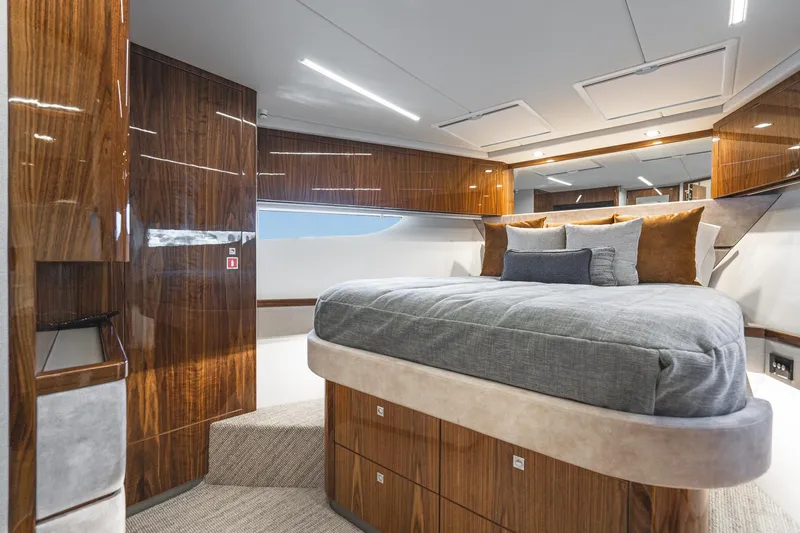 Slide: The Image of Luxurious interior of 2023 Riviera 64 Sports Motor Yacht with elegant wood finish and window view. - 47
