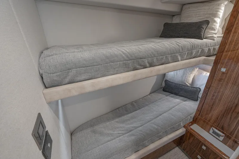 Slide: The Image of Luxurious bathroom interior of 2023 Riviera 64 Sports Motor Yacht with wood accents and ocean view. - 50