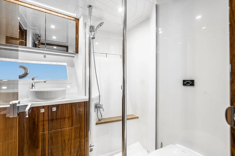 Slide: The Image of Laundry room in 2023 Riviera 64 Sports Motor Yacht, featuring modern appliances and sleek design. - 51