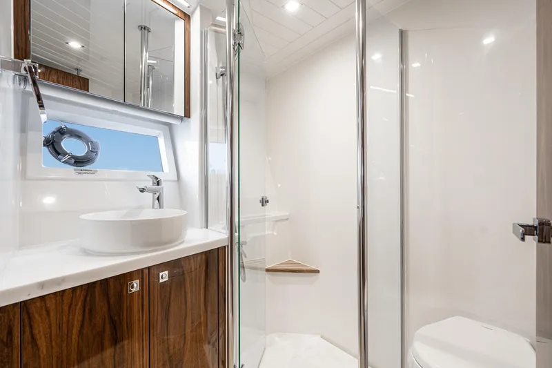 Slide: The Image of Laundry area with Miele appliances on 2023 Riviera 64 Sports Motor Yacht. - 52