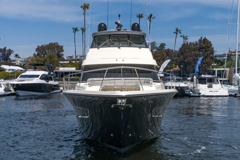 Slide: The Image of 2023 Riviera 64 Sports Motor Yacht, rear view, featuring spacious deck and modern amenities. - 9