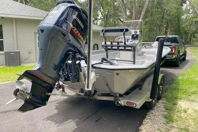 Slide: The Image of 2021 Avid 23 FS Magnum boat with Yamaha outboard motor on trailer. - 2