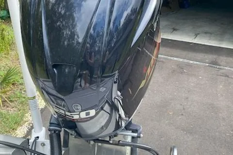 Slide: The Image of 2021 Avid 23 FS Magnum boat with powerful outboard motor in driveway. - 4