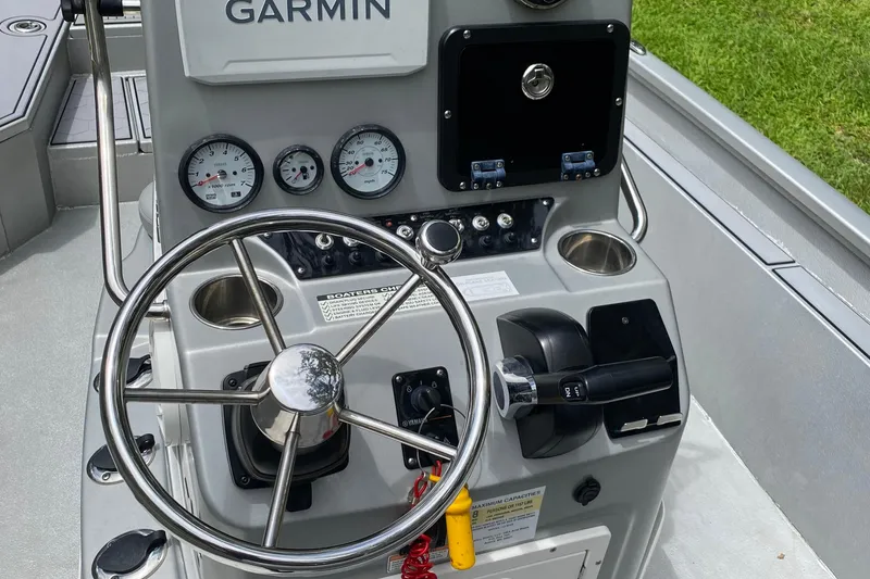 Slide: The Image of Control panel of 2021 Avid 23 FS Magnum boat with Garmin navigation system. - 5