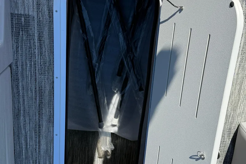 Slide: The Image of Storage compartment in 2026 Bentley Pontoons Legacy 223 Swingback boat. - 15
