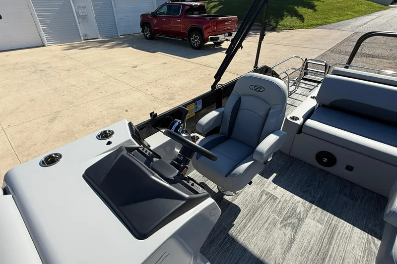 Slide: The Image of 2026 Bentley Pontoons Legacy 223 Swingback interior with helm and seating area. - 16