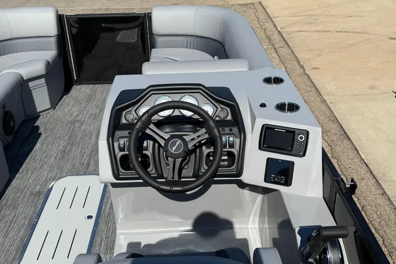 Slide: The Image of 2026 Bentley Pontoons Legacy 223 Swingback dashboard with steering wheel and controls. - 17