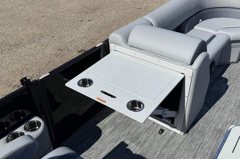 Slide: The Image of 2026 Bentley Pontoons Legacy 223 Swingback interior with foldable table and cup holders. - 20