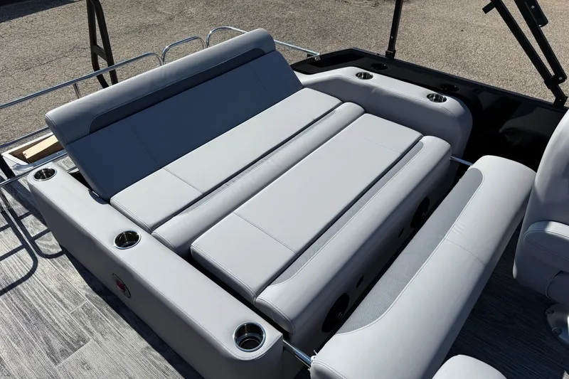 Slide: The Image of 2026 Bentley Pontoons Legacy 223 Swingback with luxurious seating and cup holders. - 25