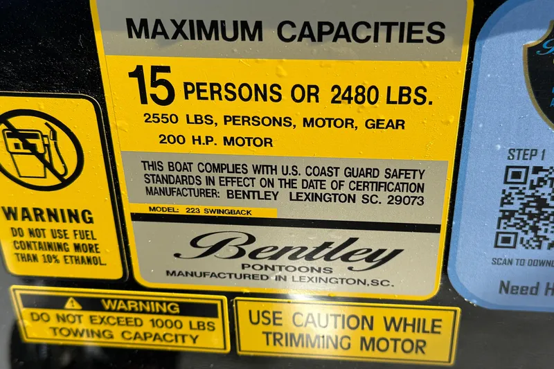 Slide: The Image of 2026 Bentley Pontoons Legacy 223 Swingback capacity label, 15 persons or 2480 lbs, 200 HP motor. - 27