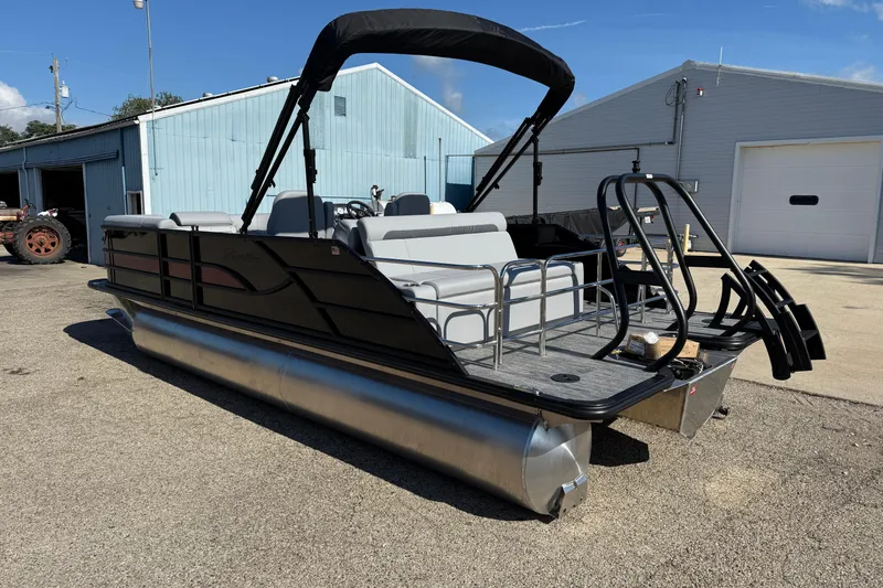 Slide: The Image of 2026 Bentley Pontoons Legacy 223 Swingback, sleek design, parked outdoors. - 5