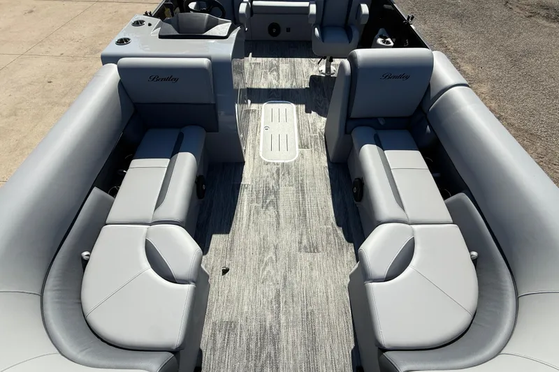 Slide: The Image of 2026 Bentley Pontoons Legacy 223 Swingback interior with gray seating and modern design. - 8