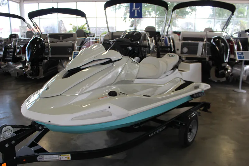 Slide: The Image of 2025 Yamaha VX Cruiser HO jet ski displayed in a showroom on a trailer. - 1