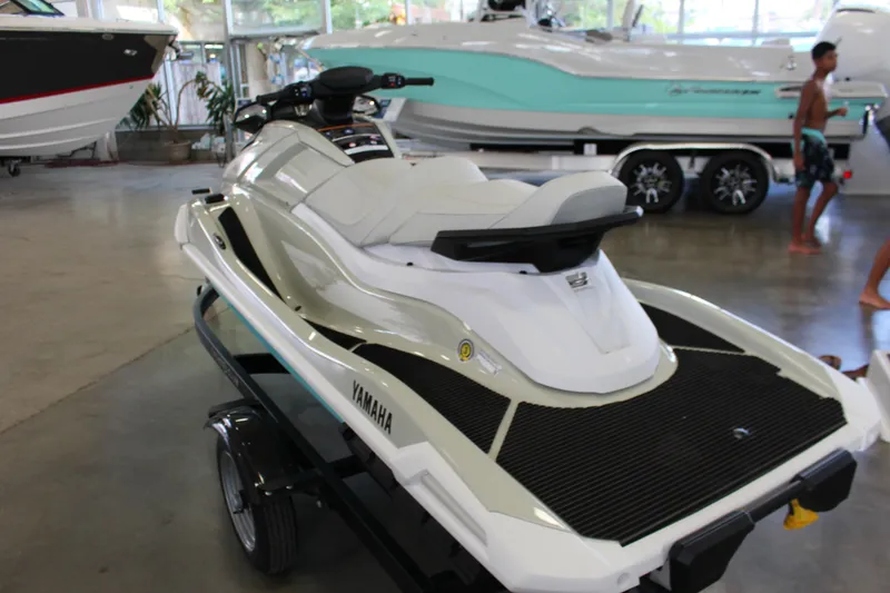 Slide: The Image of 2025 Yamaha VX Cruiser HO jet ski displayed in a showroom, featuring sleek design and modern features. - 4