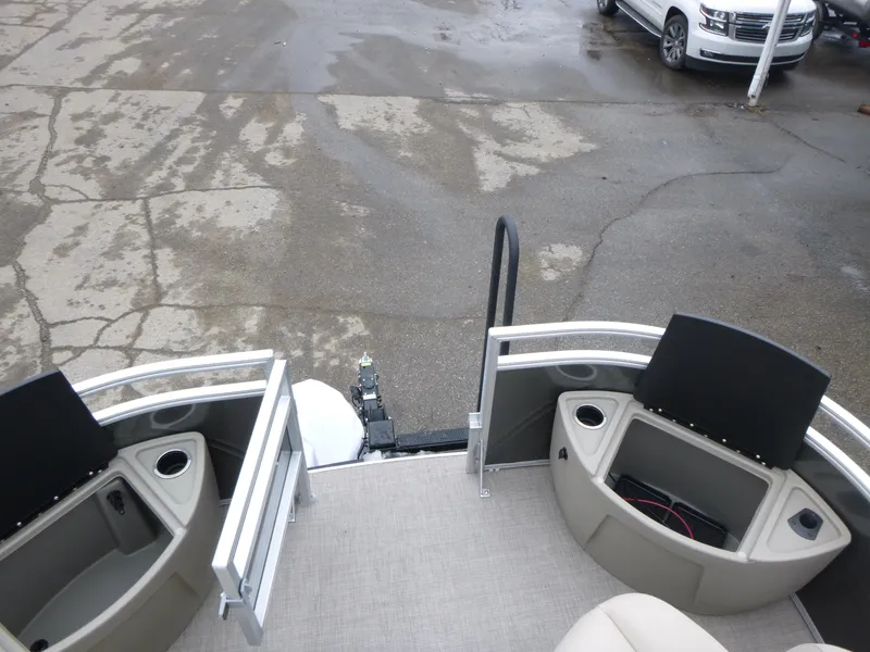 Slide: The Image of 2025 Sun Tracker Fishin' Barge 20 DLX pontoon boat with seating and storage compartments. - 17