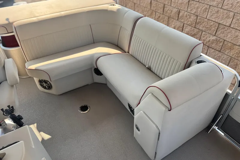 Slide: The Image of Luxurious seating on 2016 Apex Qwest 7518 LS pontoon boat, featuring plush upholstery. - 14