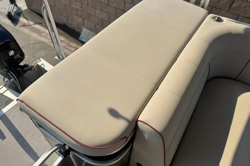 Slide: The Image of 2016 Apex Qwest 7518 LS boat seat with beige upholstery and red trim. - 17