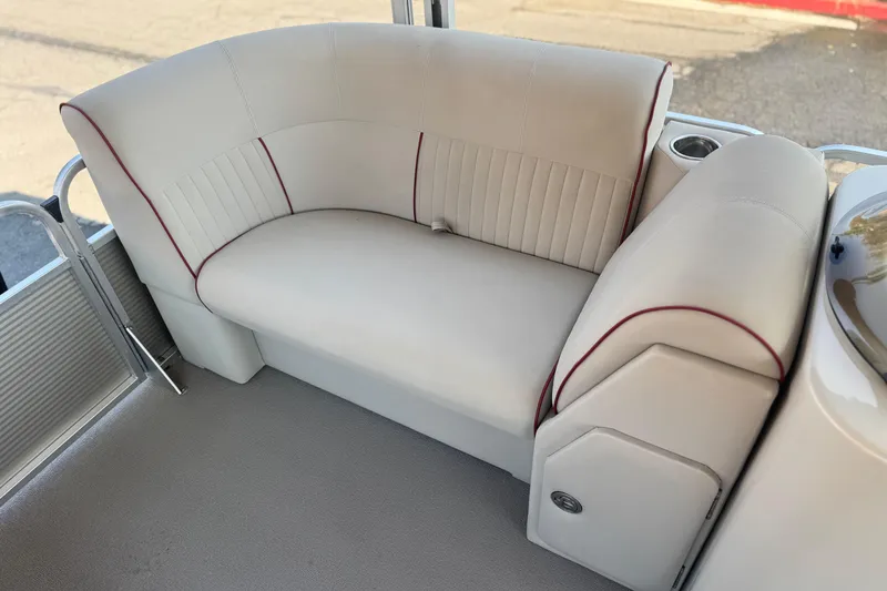 Slide: The Image of 2016 Apex Qwest 7518 LS boat interior with beige seating and red accents. - 11