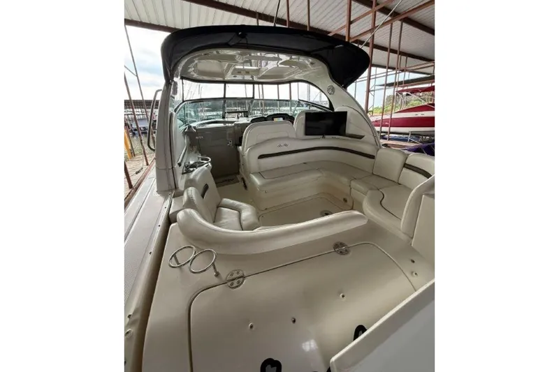 Slide: The Image of 2006 Sea Ray 38 Sundancer interior with spacious seating and modern amenities. - 10