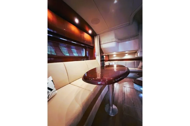 Slide: The Image of Luxurious interior of 2006 Sea Ray 38 Sundancer yacht with elegant seating and wooden table. - 22