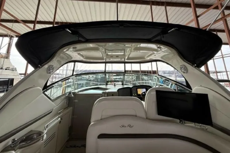 Slide: The Image of Interior view of 2006 Sea Ray 38 Sundancer yacht with helm and seating area. - 24