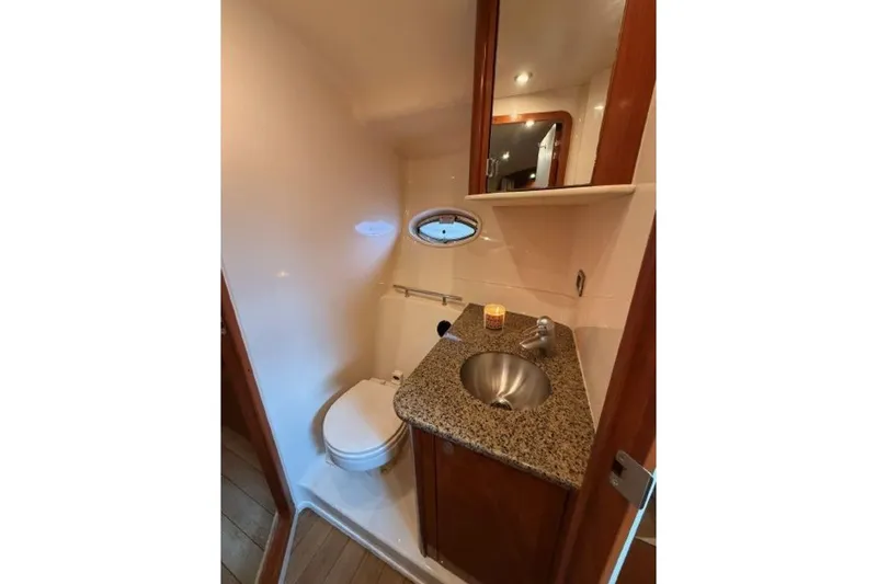 Slide: The Image of Luxurious bathroom in 2006 Sea Ray 38 Sundancer yacht with granite countertop. - 34