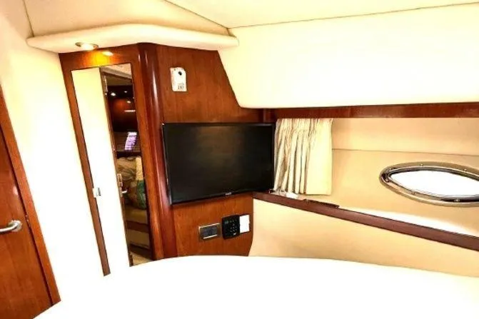 Slide: The Image of Luxurious interior of 2006 Sea Ray 38 Sundancer yacht with TV and porthole. - 35