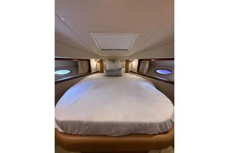 Slide: The Image of Luxurious cabin interior of 2006 Sea Ray 38 Sundancer yacht with cozy bedding. - 40