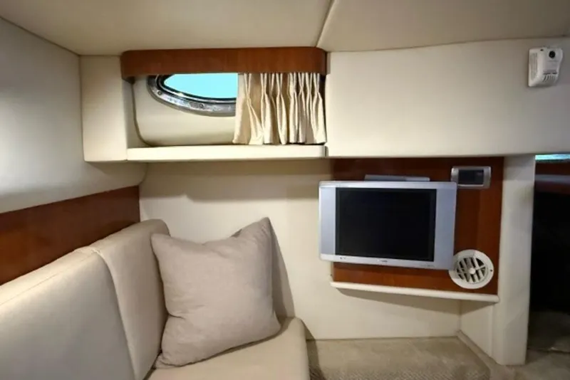 Slide: The Image of Interior of 2006 Sea Ray 38 Sundancer with sofa, window, and wall-mounted TV. - 43