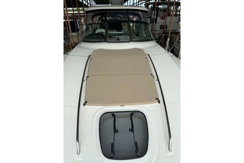 Slide: The Image of 2006 Sea Ray 38 Sundancer yacht with sunpad and hatch on deck. - 44