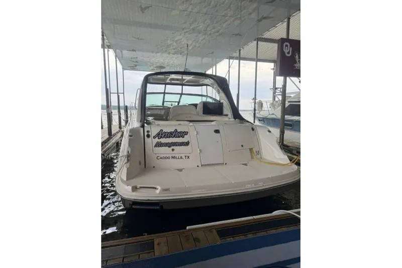 Slide: The Image of 2006 Sea Ray 38 Sundancer docked, rear view, with "Anchor Management" text, Caddo Mills, TX. - 6