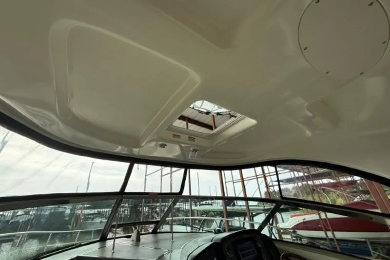 Slide: The Image of Interior view of 2006 Sea Ray 38 Sundancer yacht cockpit with sunroof. - 7