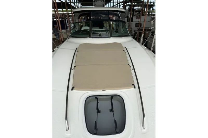 Slide: The Image of 2006 Sea Ray 38 Sundancer yacht with sunpad and hatch on deck. - 9