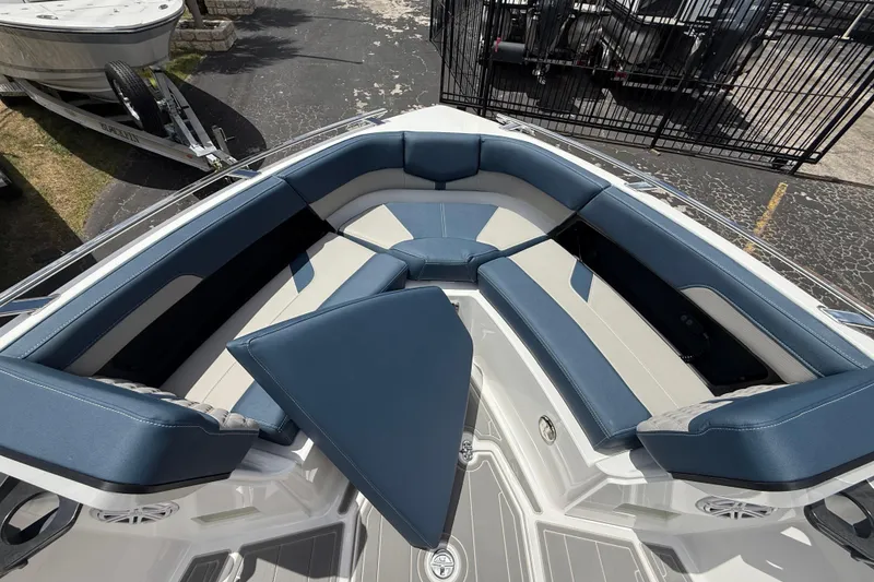 Slide: The Image of 2026 Monterey 27 SD Elite boat interior with blue and white seating arrangement. - 9